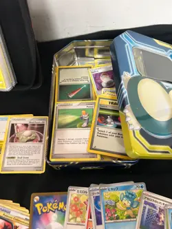 Lot of Previously Owned Pokemon Cards Includes A GX Tag Team Tin and Binder - Image 2