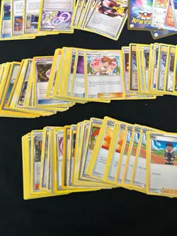 Lot of Previously Owned Pokemon Cards Includes A GX Tag Team Tin and Binder - Image 4