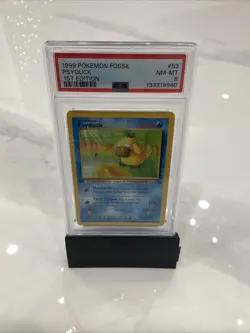 1999 Pokemon Fossil 53 Psyduck 1st Edition PSA 8 - Image 1