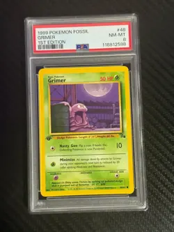 1999 Pokemon Fossil 1st Edition Grimer PSA 8 #48 Card - Image 1