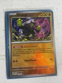 Okidogi Poke Ball Pattern 057/131 Prismatic Evolutions Holo Pokemon Card TCG NM - Image 1