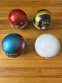 Lot of 4 Pokemon TCG Pokeball Tins, 1 H20, 3 D21, 12 Total Booster Packs, Sealed - Image 1