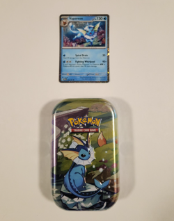 Pokemon Prismatic Evolutions Vaporeon TCG Mini Tin Sealed + Vaporeon Foil Card - Image 1