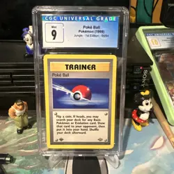 CGC 9 MINT Poke Ball 1st Edition Jungle 64/64 Pokemon 1999 Trainer - Image 1