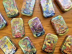 Pokemon TCG: Prismatic Evolutions Mini Tin! One Random Sealed Tin w/ 2 Packs! - Image 1
