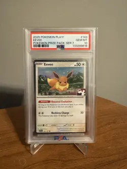 2025 POKEMON PLAY! POKEMON PRIZE PACK: SERIES 7 #143 EEVEE PSA 10 *LOW POP* - Image 1
