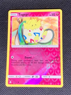 Togepi 136/214 Reverse Holo - Unbroken Bonds Pokemon Card - LP - Image 1