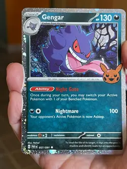 POKEMON GENGAR 057/091 COSMOS HOLO TRICK! OR TRADE SWIRLS NM PALDEAN FATES CARD - Image 1