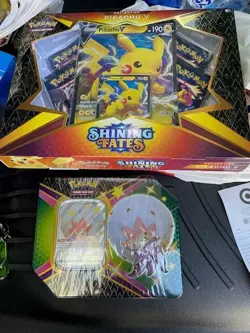 Pokemon Shining Fates Pikachu V & Eldegoss V Tin, Factory Sealed Lot of 2 - Image 1