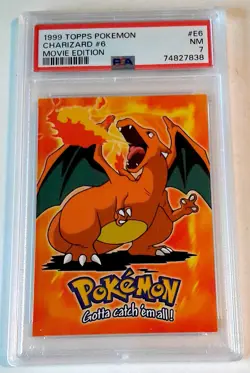 1999 TOPPS POKEMON CHARIZARD #E6 PSA 7 MOVIE 1ST EDITION BLUE LOGO - Image 1