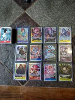 Assorted One Piece Holo Trading Cards And Partial Basic Non Holo Starter Set - Image 1