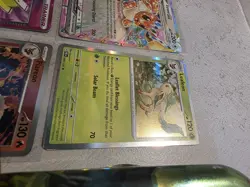 Prismatic Evolutions Eevee / Leafeon 4 Card Bundle With Tin - Image 4