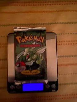 HeavyU Pokemon 1st Edition Sealed Spanish Jungle Booster Pack - Image 1