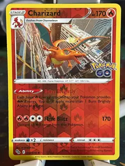 POKEMON CHARIZARD #010/078 RARE REVERSE HOLOFOIL NM POKEMON GO CARD - Image 1