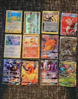 Pokemon 12 Card Lot. Umbreon, Rare Ampharos, Celebi Promo, Charizard - Image 1