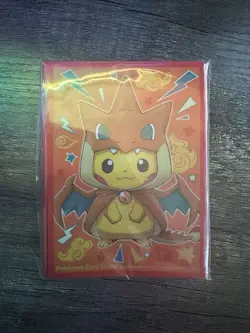 SEALED Pokemon Center Exclusive Poncho Pikachu Mega Charizard Y Card Sleeves - Image 1