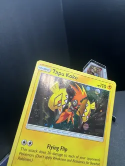 Pokemon TCG Sun & Moon Tapu Koko SM30 Cosmos Holo Black Star Promo SWIRL Dent - Image 2