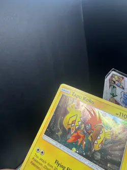 Pokemon TCG Sun & Moon Tapu Koko SM30 Cosmos Holo Black Star Promo SWIRL Dent - Image 3