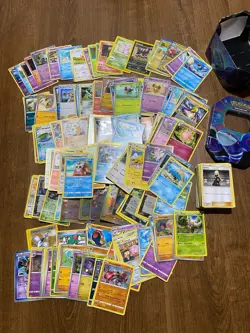 Joblot Pokemon Cards 250+ Cards Mixed Varied Years + Pokemon Tin #2 Bundle - Image 1