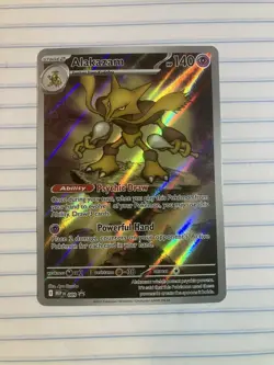 Pokemon TCG Alakazam 009 ME Black Star Promo In NM Condition - Image 1
