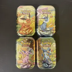 LOT OF 4 Pokemon TCG Prismatic Evolutions Mini Tins - Image 1