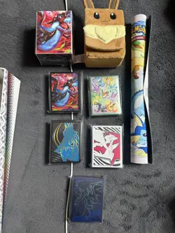 Prismatic Evolutions SPC Eevee Deck Box And Play Mat & All Pokemon sleeves - Image 1