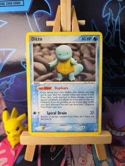 Ditto (Squirtle) 64/113 - EX Delta Species - Pokemon TCG Card - Yuka Morii - Image 1