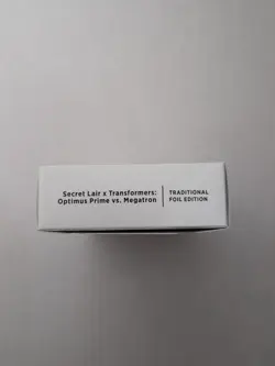 MTG Secret Lair x Transformers: Optimus Prime vs. Megatron Foil Edition, Sealed - Image 1