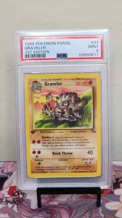 1999 POKEMON FOSSIL #37 GRAVELER 1ST EDITION - PSA 9 - Image 1