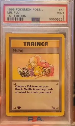 The Pokemon Company Mr. Fuji Fossil 58/62 1st Edition Trainer PSA 9 English - Image 1