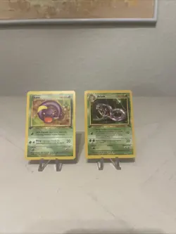 Pokemon 1st Edition Arbok 31/62 and Ekans 46/62 Fossil Near Mint To Mint - Image 1