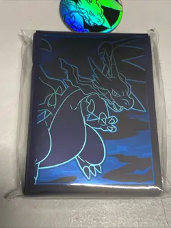 Mega Evolution Phantasmal Flames ETB Card Sleeves 65 count And Charizard Coins - Image 3