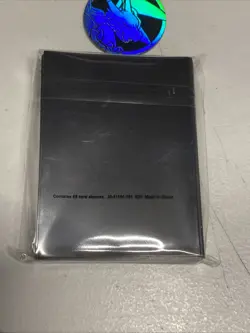 Mega Evolution Phantasmal Flames ETB Card Sleeves 65 count And Charizard Coins - Image 5