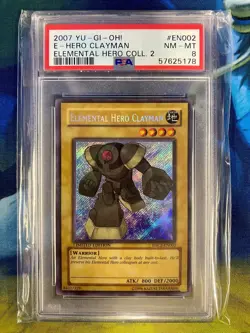 2007 YU-GI-OH! ELEMENTAL HERO COLLECTION 2 #EN002 ELEMENTAL HERO CLAYMAN PSA 8 - Image 1