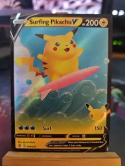 Pokemon TCG Surfing Pikachu v Ultra Rare Holo Card 008/025 Celebrations NM - Image 1