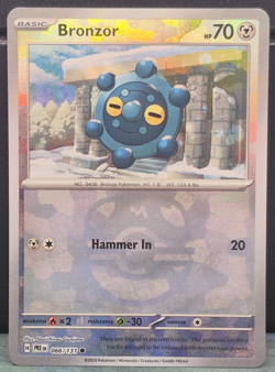 Bronzor 066/131 Master Ball Pattern Reverse Holo Prismatic Evolutions Pokemon NM - Image 1
