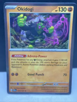 Pokemon TCG Okidogi Prismatic Evolutions Master Ball Pattern Holo Card 057/131 - Image 1