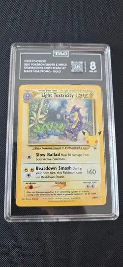 Light Toxitricity Celebrations Promo SWSH137 TAG Graded 8 Pokemon Card - Image 1