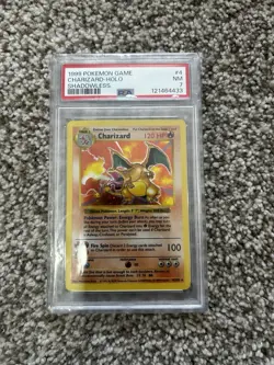 1999 POKEMON BASE SET SHADOWLESS #4 CHARIZARD-HOLO PSA 7 - Image 1