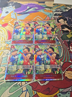 One Piece OP13-007 Ace Sabo Luffy Carrying His Will Super Rare Foil 4x Playset - Image 1
