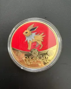 POKEMON GOLD PLATED COLLECTIBLE COIN JOLTEON EEVEELUTION - Image 1