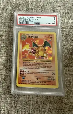 1999 POKEMON BASE SET SHADOWLESS #4 CHARIZARD-HOLO PSA 5 - Image 1