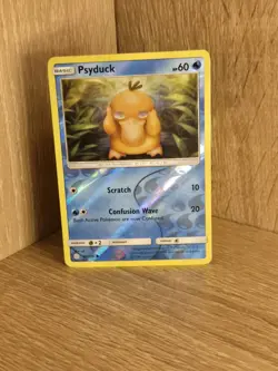 Psyduck 40/236 Cosmic Eclipse Sun & Moon Reverse Holo Pokemon TCG - Image 1