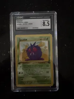 CGC 8.5 - 1999 1st Edition Venonat 63/64 Jungle WOTC Vintage Pokemon Card - Image 1