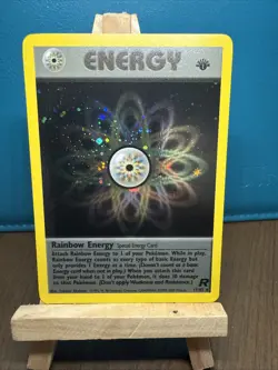 2000 Pokemon Team Rocket 1st Edition #17/82 Rainbow Energy Holo NM with SWIRL - Image 1