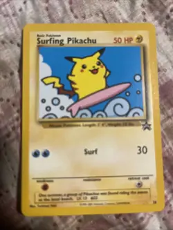 Vintage 2001 POKEMON PROMO BLACK STAR POKEMON LEAGUE #28 SURFING PIKACHU PSA 7 - Image 1