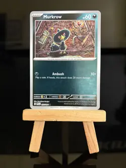 Murkrow 057/094 Me02: Phantasmal Flames Reverse Holo Common Pokemon TCG Card - Image 1