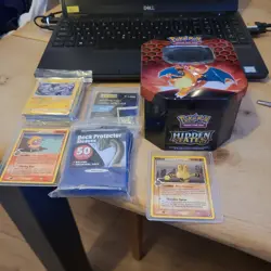 Pokemon Hidden Fates Charizard Tin Box plus cards - Image 1