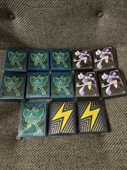 Lot Of 12 Pokemon New Sealed Card Sleeves From Different ETBs - Image 1