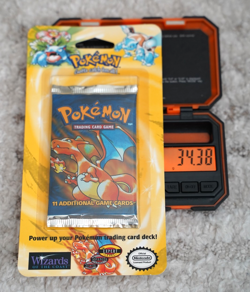 34.38g - Pokemon 1999 WOTC Base Set Unlimited Booster Blister Pack Charizard - Image 1